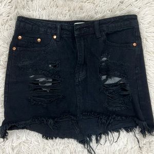 Black denim ripped mini skirt